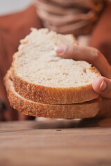 A Delicious Loaf of Freshly Sliced Bread Being Held by a Persons Hand Enthusiastically