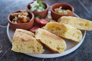A Flavorful Breakfast Platter with Freshly Baked Bread and Assorted Sides to Enjoy