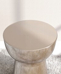 High angle view of round shiny gold podium table in sunlight on gray white shag rug wall for...
