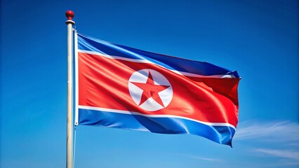 Vibrant red and blue North Korean national flag waving proudly in the wind, symbolizing independence and national