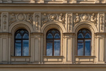 Obraz premium View of the exterior stucco decoration of the apartment house of the merchant Ritz-A-Porto (formerly owned by Marquis Alexander Paullucci) on the Moika River embankment, St. Petersburg, Russia