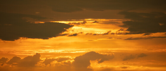 The setting sun reddened the sky, the countryside skyline, and the scenery background.