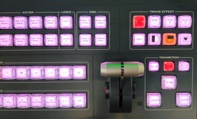 Top view of console bar and buttons of Video switcher in broadcast television production studio.