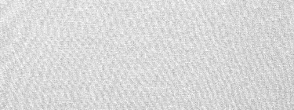 Textured white cotton linen viscose fabric background with subtle natural patterns.