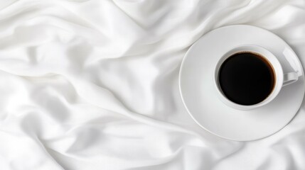 Obraz premium A chic summer hat rests on soft ruffled fabric, accompanied by a steaming cup of coffee, evoking a serene vibe.