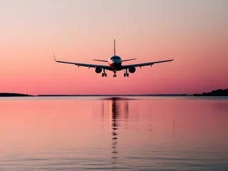 Rolgordijnen zonder boren a plane is flying over a body of water with the sun setting behind it. © JIANG CHENG YOU