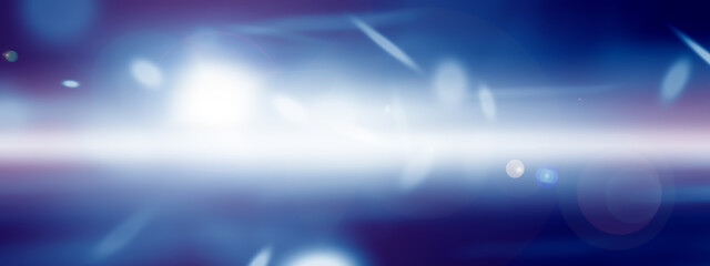 Blurred glitter effects background. Bright soft blue with hints of pearl color. Christmas background. Festive Christmas backdrop with holiday charm. Blurred bokeh light on dark blue background. Christ