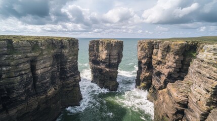 Majestic Coastal Rock Formation with Crashing Waves Amid Moody Cloudy Sky