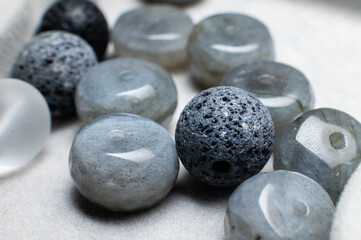 Group of multi-coloured balls made of various natural decorative stones, close-up shot, abstract background