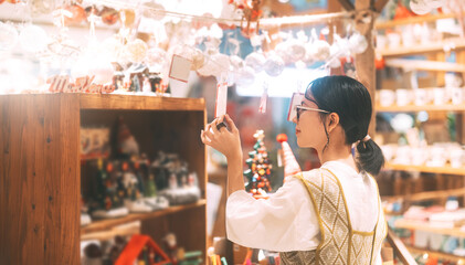 Asian woman choosing gift shop on Christmas and happy new year holidays