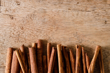 Dried Cinnamomum cassia on wooden table.