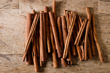 Dried Cinnamomum cassia on wooden table.