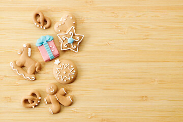 Christmas homemade gingerbread cookies on wooden table.