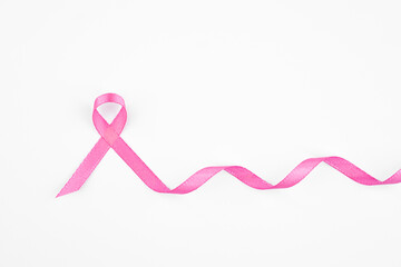 Pink ribbon symbol representing awareness and support for breast cancer initiatives