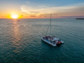 Catamaran boat with holiday makers of the coast of Key West, Florida, United States.