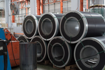 Metalwork manufacturing, warehouse of raw materials. Rolls of metal sheet or Rolls of stainless steel in aluminium material warehouse