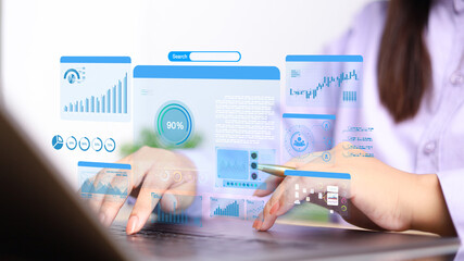 Businesswoman using computer for development and Analytics Data technology management System for report marketing strategy planning. graph analysis and information on a futuristic virtual screen.
