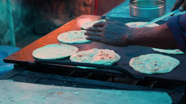 Preparation of paratha flatbread. Various types of street food. Types of flatbreads in India.