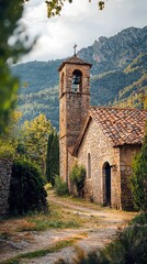 Fototapeta premium Scenic view of a charming stone church by a winding path, surrounded by lush greenery and majestic mountains in the background.