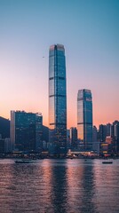 Fototapeta premium Stunning urban skyline at sunset, featuring tall skyscrapers reflecting on the calm water, creating a breathtaking cityscape.
