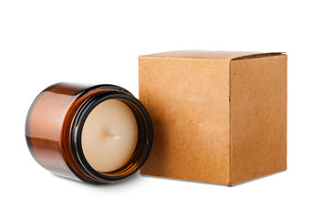 Amber glass jar with lid beside a brown kraft paper box