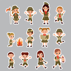 A set of stickers with scouts. Cheerful boy and girl scouts in different poses.
