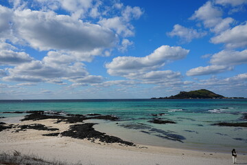 fascinating seascape with far island and fine clouds