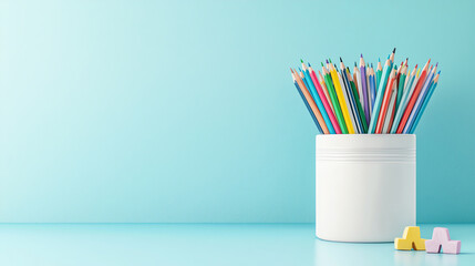 Colorful pencils in a white container against a light blue background, perfect for creative projects.