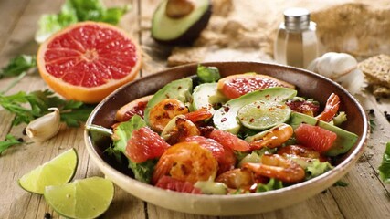 mixed salad with grilled shrimp, avocado, and grapefruit. Ideal for festive meals and healthy eating