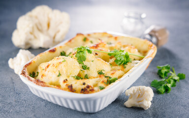 baked cauliflower gratin with ingredients. Perfect for healthy eating and baked dishes