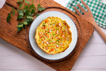 Individual quiche with vegetables and crab surimi. Top view table with decoration.