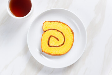 roll cake or Bolu Gulung pieces with cream. with copy space. perfect for recipe, article, catalogue, or any commercial purposes.
