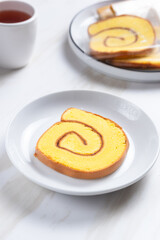 roll cake or Bolu Gulung pieces with cream. with copy space. perfect for recipe, article, catalogue, or any commercial purposes.
