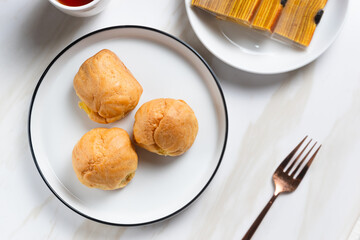 Choux pastry or cream puff. Profiterole. Kue sus. freshly baked. with vanilla cream filling. with copy space. perfect for recipe, article, catalogue, or any commercial purposes.