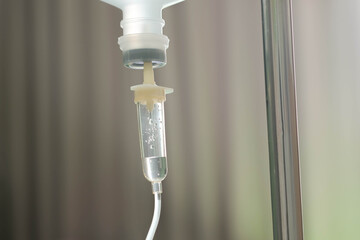 Saline IV drip for patient and Infusion pump in hospital, In the hospital with a fragment of medical equipment.