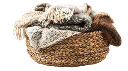 Obraz premium Basket filled with winter laundry on white background