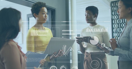 Business data analytics image over diverse professionals discussing in office