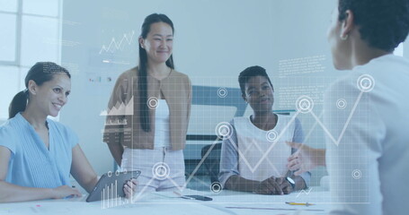 Business data analytics image over diverse women collaborating in office meeting