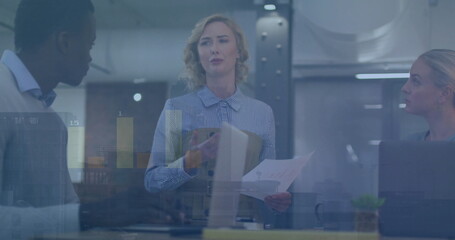 Image of financial data processing over diverse business people in office