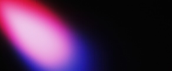 Fototapeta premium A soft, blurred gradient of color transitions from dark to vibrant pink and blue against a black background, creating an abstract lighting effect.