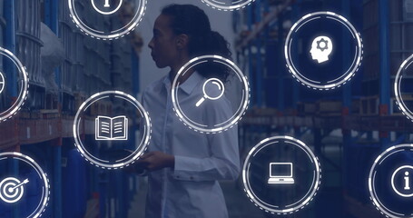 Image of icons and digital data processing over biracial woman working in warehouse