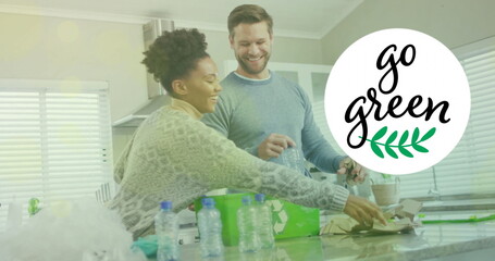 Image of go green text and light spots over diverse couple sorting plastic bottles