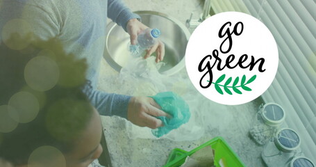 Image of go green text and light spots over diverse couple sorting plastic bottles