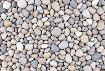 Cluster of pebbles in varying sizes shapes and colors creating a