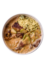 Bowl of food with beef, bulgur, tomatoes, zucchini and sauce