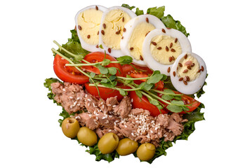 Salad with tuna pieces, boiled egg, cherry tomatoes, lettuce