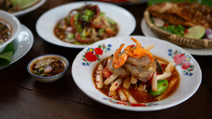 Set of Thai food, papaya salad or spicy salad somtum Thailand on the wooden table, thai spicy food