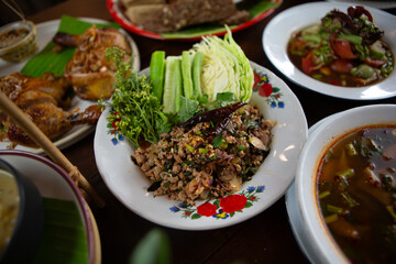 Set of Thai food, papaya salad or spicy salad somtum Thailand on the wooden table, thai spicy food