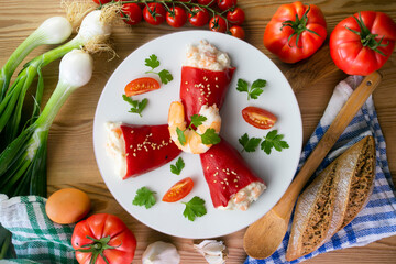 Red piquillo peppers stuffed with cod. Top view table with  decoration.