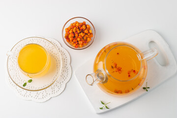 Sea buckthorn tea drink with oranges and mint. Autumn comfort hot drink. Herbal vitamin tea. 